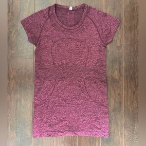 Lululemon women’s Swiftly Tech Short Sleeve *hip length*.  Size 8, Merlot.